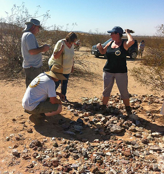 Looking for goodies in the claim rock pile.