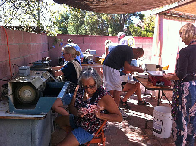 More club members enjoying rock cutting and polishing