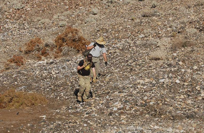 Larry and Garrett coming off the hill with their haul of marble.