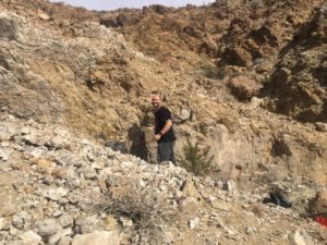 Omid collecting the Silver Lace Onyx at the top of the mountain